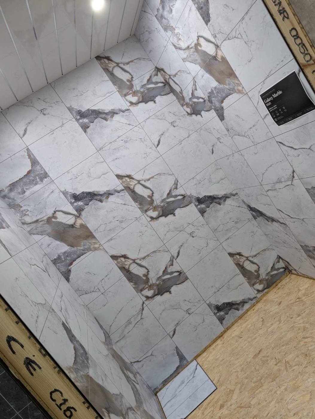 Marble-effect wall panelling by Arch Property Maintenance